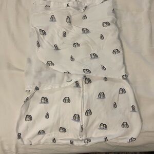Halo SleepSack Swaddle in White with Black Penguin Prints